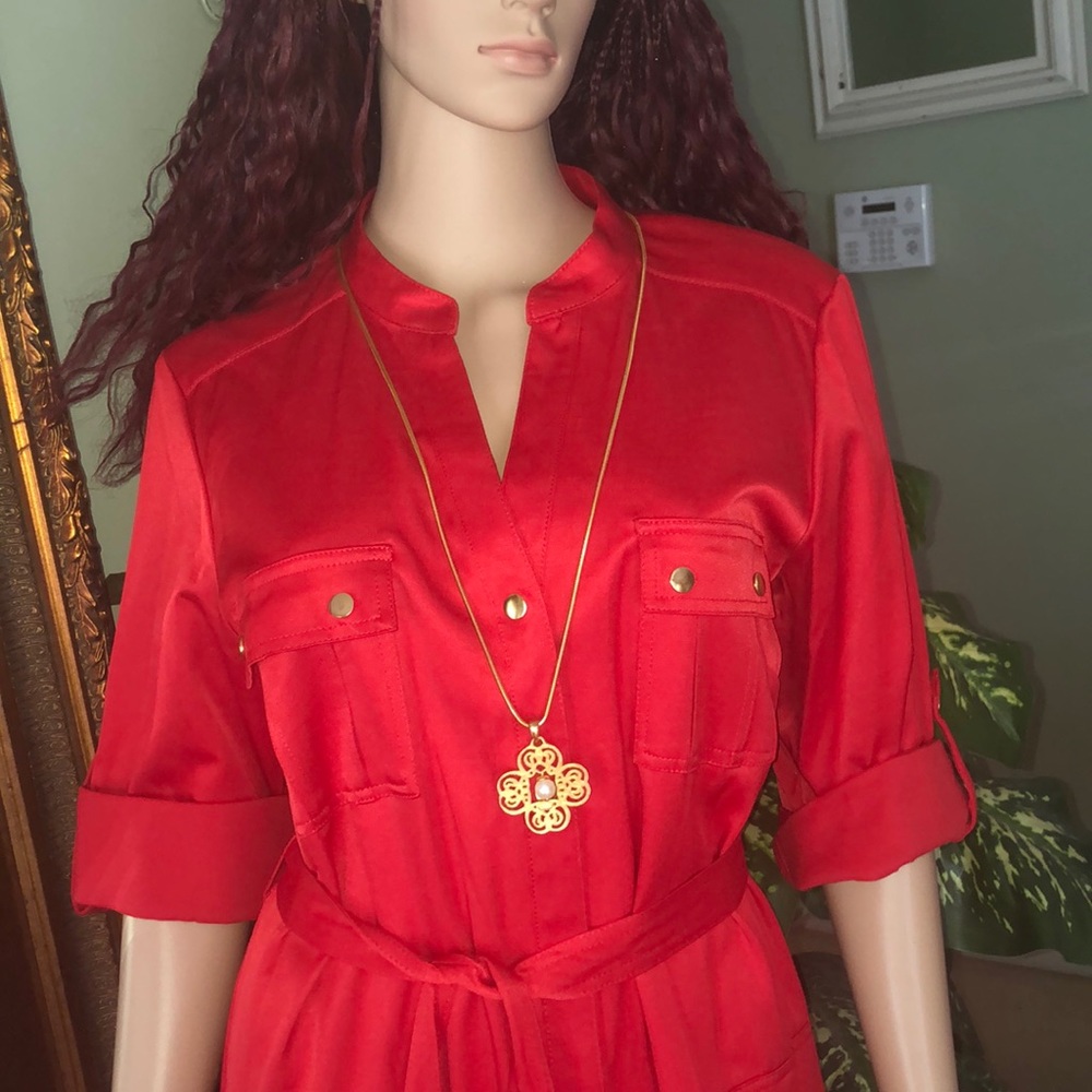 Red dress with golden buttons.